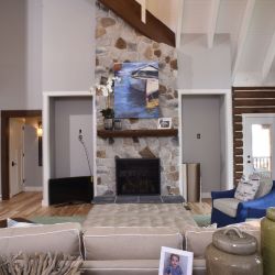 Light Neutral Stone Covered Gas Fireplace 