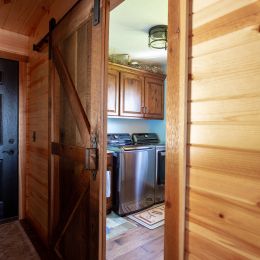 Laundry Room with a Rustic Sliding Barn Door Entry