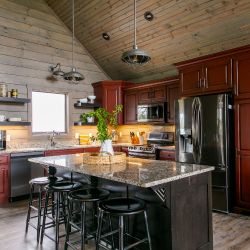 Red Kitchen Cabinets with Brown Island