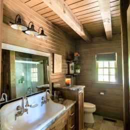 Full Bathroom with Square Rough Sawn Log Joists Above