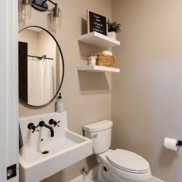 Main Floor Bathroom with Wall Mounted Sink