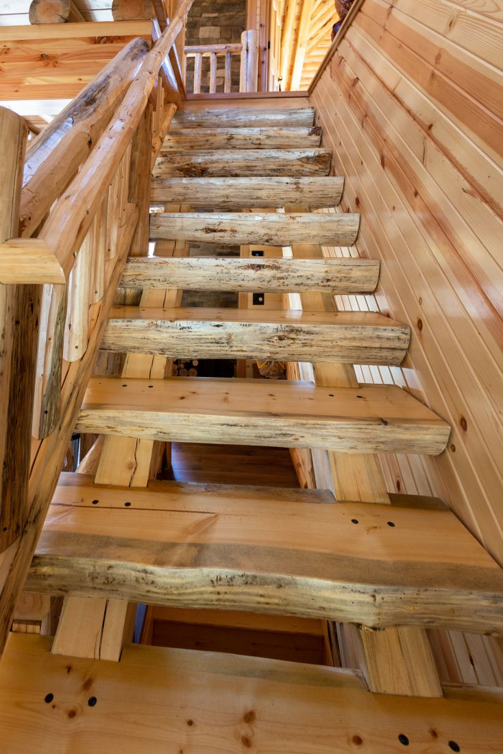 Heavy Timber Log Stairway with Clean Peeled Treads and Railing
