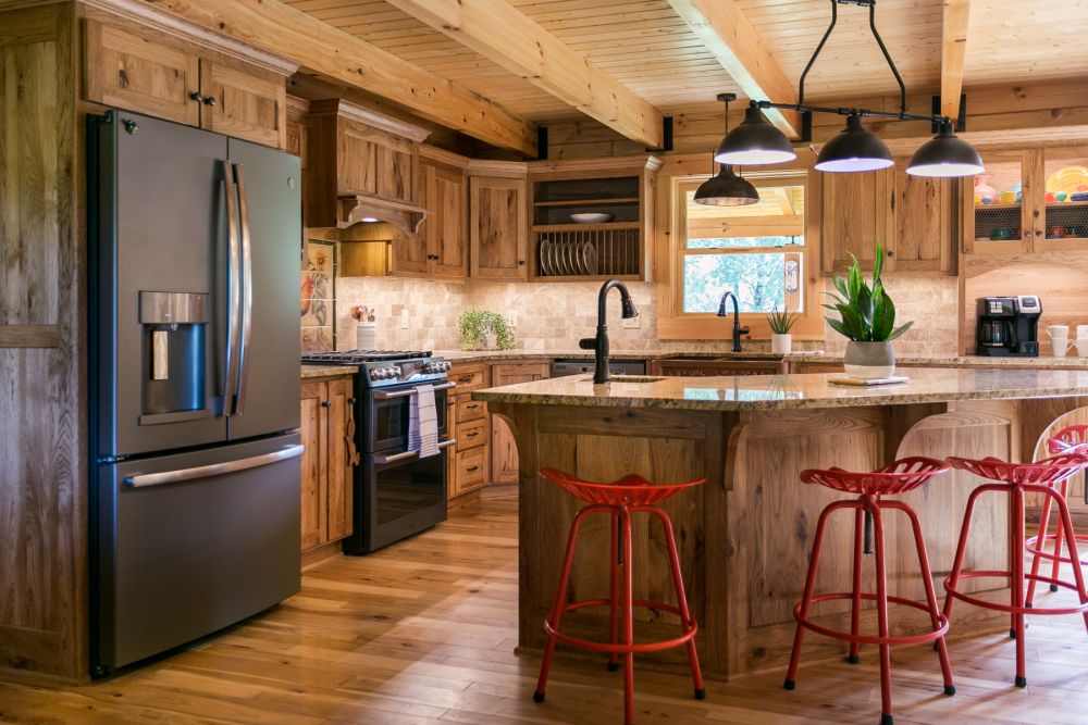 Log Home Kitchen with Custom Cabinetry and Graphite Appliances