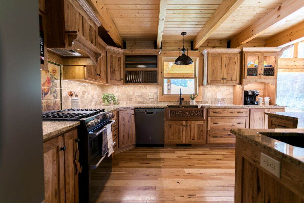 Log Home Kitchen with Imprinted Copper Farmhouse Sink