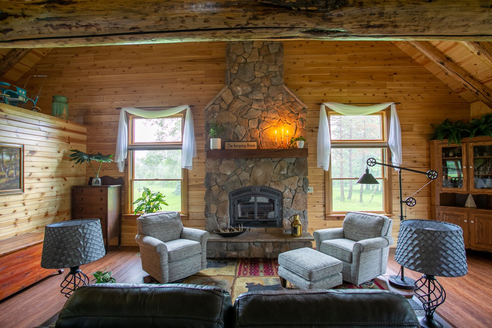 The Keeping Room with a stone covered fireplace 