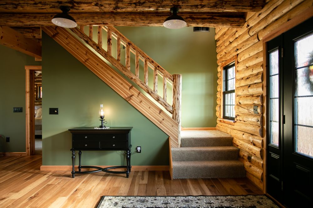 Conventional Stairway with Rustic Log Railing and Carpeted Steps