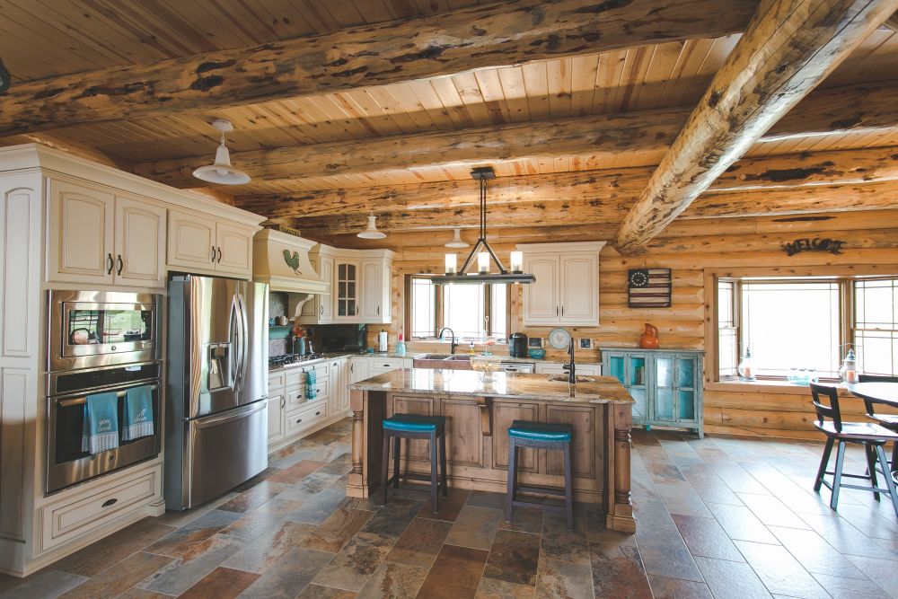 Log Home Custom Kitchen with White Painted Cabinets and Stained Island