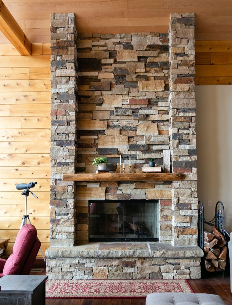 Stone Covered Fireplace with Log Mantle