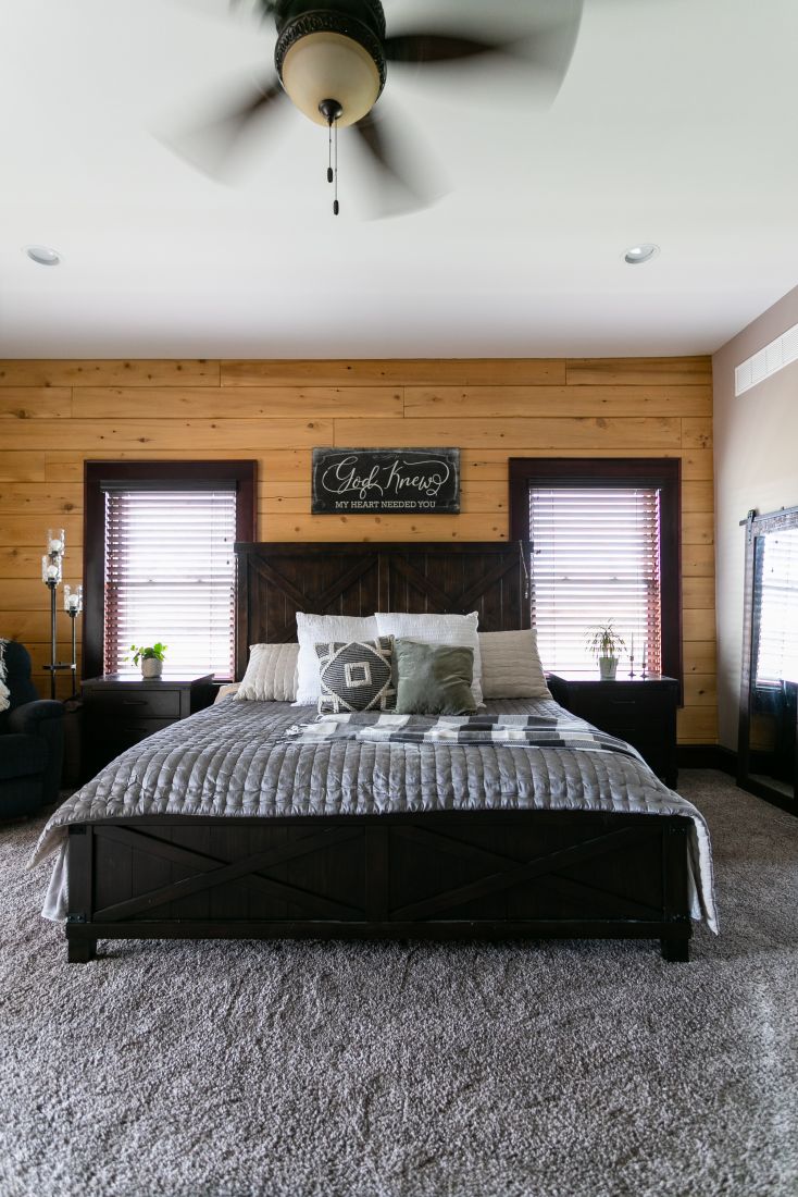 Master Bedroom with Flat Log Wall and Drywall Ceiling