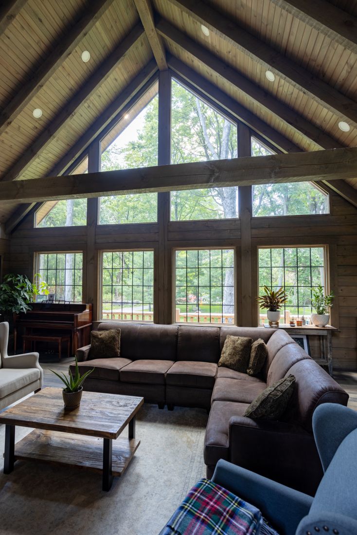 Log Home Great Room with Floor to Ceiling Windows